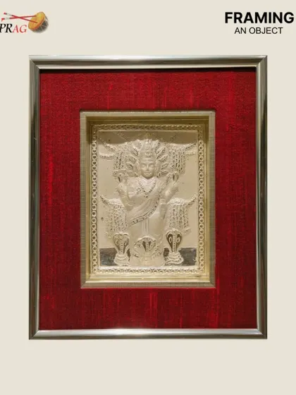 We were honored to frame this silver deity, a precious object of devotion. We chose a silver ornate frame with a rich red raw silk cloth mount to create a sacred and protected space for the artifact.