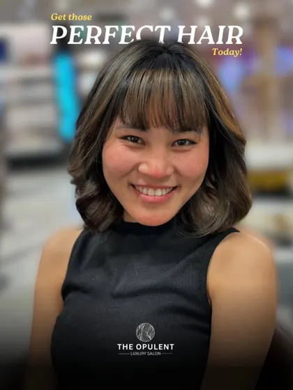Get that perfect hair you've been dreaming of. This client is glowing with her new cut, featuring a stylish fringe and soft layers that frame her face beautifully.