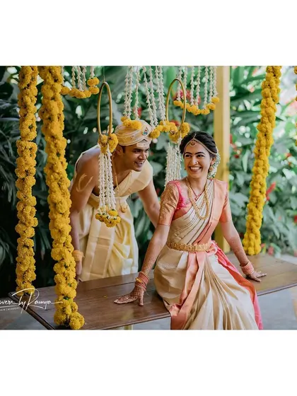 The couple enjoying a moment on the floral swing.