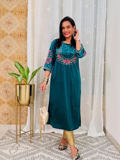 A beautiful teal green velvet kurta with floral embroidery on the sleeves. This is a very elegant and rich-looking piece for the winter festive season.