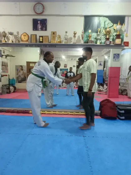 A handshake for a new green belt.