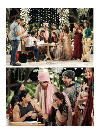 The moment of signing the marriage register, surrounded by laughing, emotional family members. This captures the official and emotional peak of their unique ceremony.