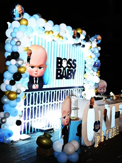 A closer look at the details for Prithvi's Boss Baby party. The setup includes a custom-lit main table, character cutouts, and a "ONE" marquee sign, all designed to make the birthday boy feel like the boss.