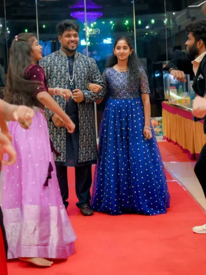 The couple makes their way down a red carpet aisle, flanked by friends and family creating a dance tunnel. This interactive and energetic entry gets everyone involved from the very beginning.