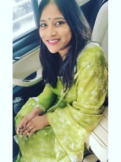 A happy client in a custom-dyed lime green Anarkali. The georgette fabric was dyed to perfectly match the floral organza dupatta, creating a fresh and unique look.
