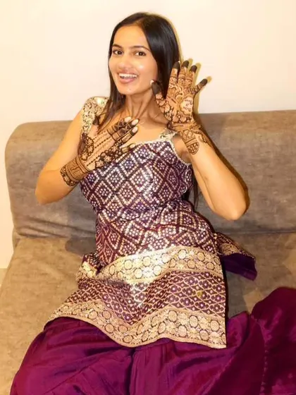 Pure joy. The groom's sister can't hide her excitement over her stunning party henna.