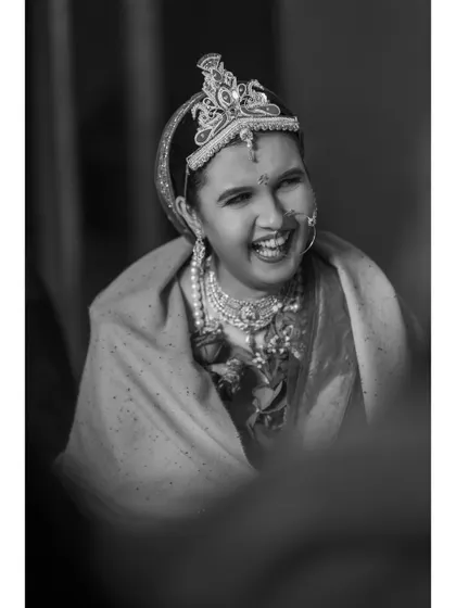A beautiful black and white candid of a bride, her face lit up with a joyous laugh. These are the timeless memories.