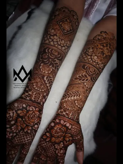Another angle of the engagement mehendi, highlighting the detailed work on the arms.