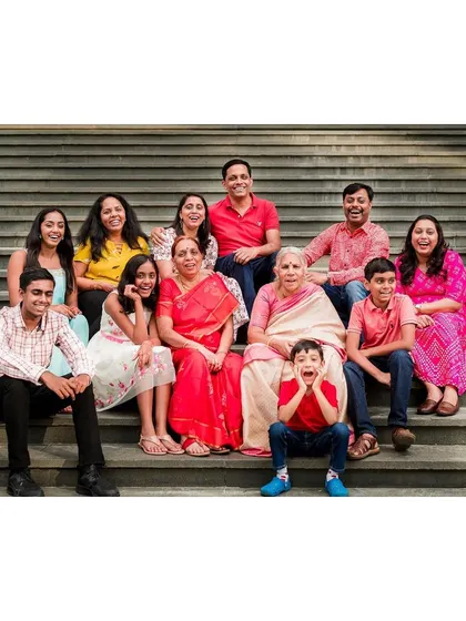 A vibrant, multi-generational family portrait session on a set of outdoor steps. We love the challenge of getting everyone from grandparents to the youngest kids laughing and looking great in one frame.