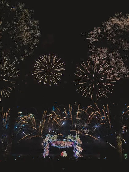 A spectacular fireworks display over a wedding mandap. For 7 years, we've been handling chaos with grace to create these moments of pure, unforgettable magic.