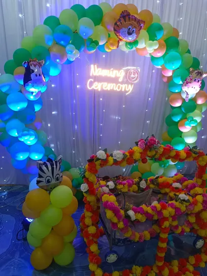A closer view of the flower-decorated cradle for the naming ceremony.