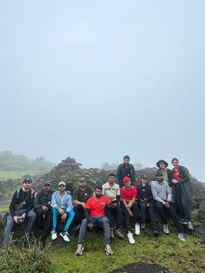 Taking a break at one of the viewpoints on a foggy day on the Kumara Parvatha trek.