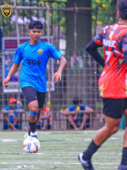 Another shot of our player on the ball, demonstrating composure and awareness during a competitive game.