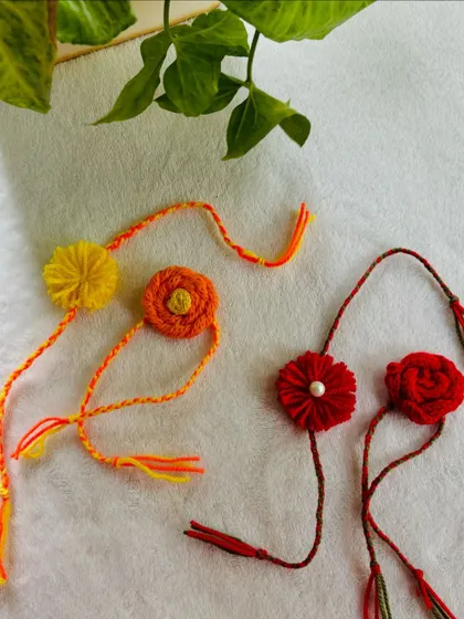 A lovely collection of handmade rakhis in warm tones of yellow, orange, and red. Each one is made to order, so you can choose the perfect colors for your celebration.