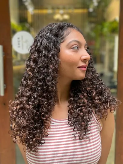 A subtle and beautiful result. This client just needed a little shaping and some gentle highlights to enhance her natural curl pattern.