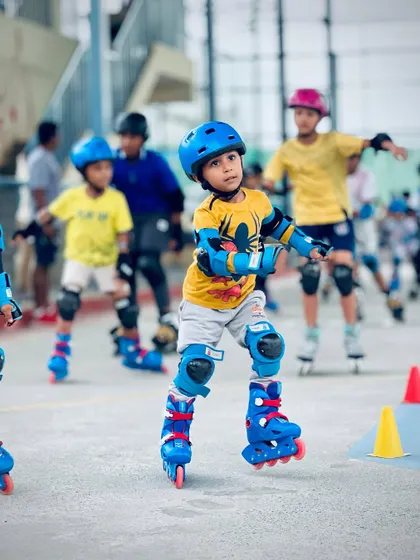 With a determined look, this skater navigates the course. We use cones and markers in our training sessions to help students practice their agility and control, key skills for any roller skater.