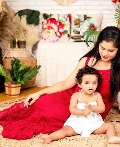 The bond between a mother and her daughter is so special. This indoor session with a bohemian setup captures a quiet, tender moment.