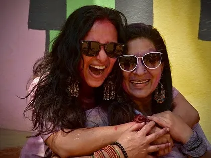 Sharing a happy, colorful hug with a friend. These are the moments that make our community so special.
