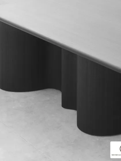 Tired of the same old dining tables? I design unique pieces like this one, which features a sleek top and a sculptural base with interesting curves, making it a functional work of art.