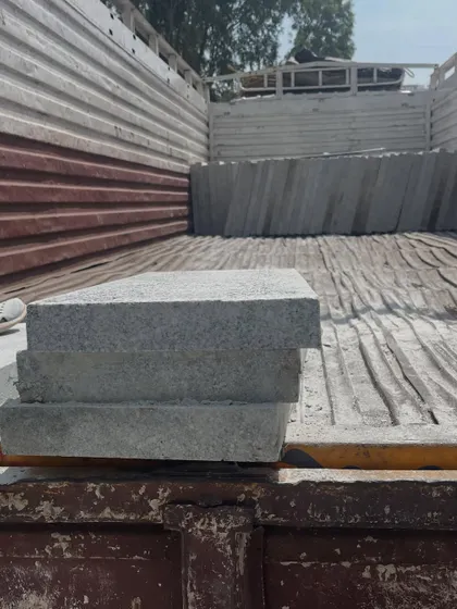 A small stack of Bangalore stone pavers loaded onto a truck, ready for a smaller residential project.
