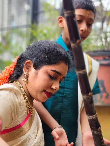 Sharing the joy of cooking with the next generation. My son watches as I prepare for the Pongal festival, learning the rituals and the importance of our traditions.