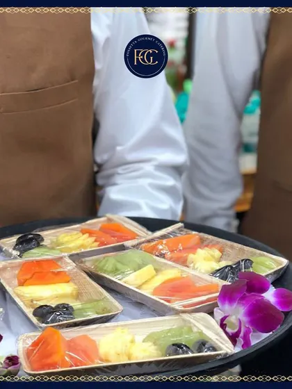 Another view of our individually portioned fresh fruit platters, showcasing a colorful mix of papaya, kiwi, and pineapple. The eco-friendly packaging is both practical and visually appealing.