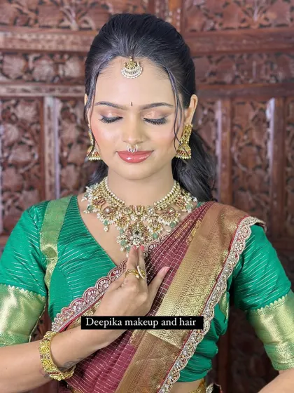 A close-up of the flawless eye makeup and traditional nose ring, key elements of this timeless South Indian bridal style.