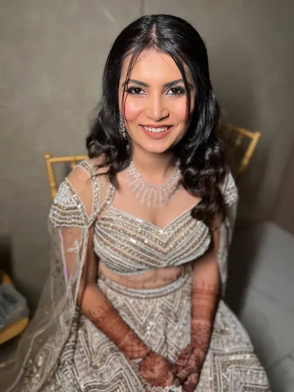 Bhoomi's smile is radiant. Her makeup is subtle and enhances her natural beauty perfectly.