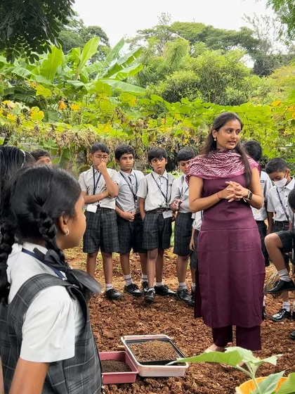 A trainer instructs a group of students on proper planting techniques. Our goal is to make learning about agriculture engaging, accessible, and memorable for every child.