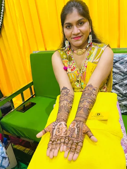 A beautiful shot of the bride displaying her completed mehndi. We love capturing these moments of joy after our work is done.