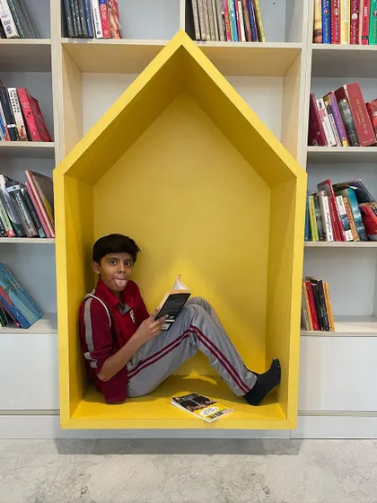 Another quick-fix solution for a library space. This house-shaped yellow reading nook provides a cozy and imaginative corner for children to get lost in a book.