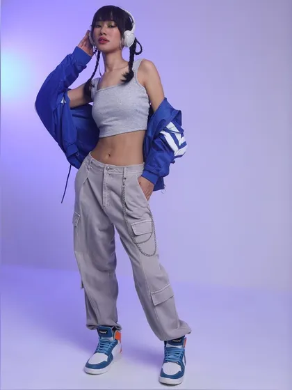 This is my take on K-pop inspired streetwear. The look combines layered casuals like a crop top and cargo pants with a bold jacket and high-top sneakers, creating a complete outfit that feels authentic to the genre and ready for an e-commerce lookbook.