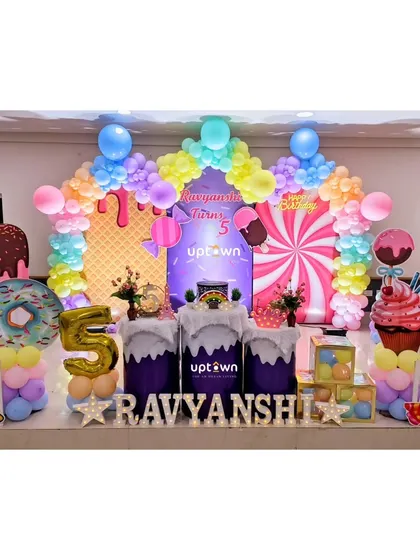 I love creating fun, imaginative worlds for children's parties. This Candyland theme is filled with colorful balloon arches, giant donut and ice cream props, and sweet-themed details for a delightful celebration.