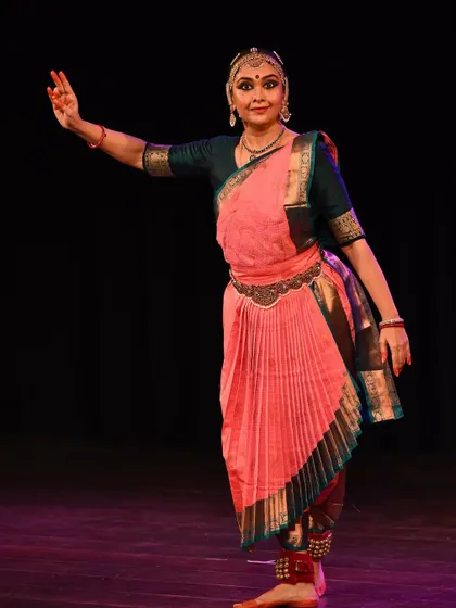A classic Bharatanatyam stance, showcasing the intricate costume and precise hand gestures. Each element is rich with meaning and tradition.