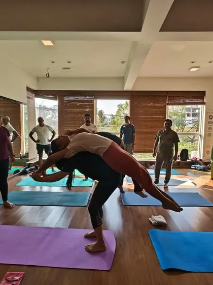 This playful partner pose is more than just fun; it's a great way to build core and upper body strength for the base partner, and a relaxing backbend for the flyer.