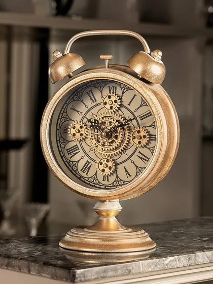 A masterpiece of design, this table clock blends old-world charm with modern engineering. The classic alarm clock shape is updated with a visible moving gear mechanism, making it a fantastic decorative piece.