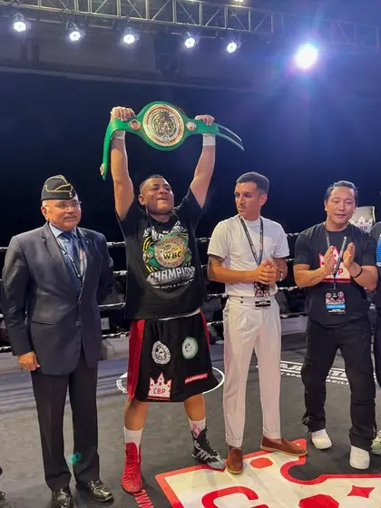 The champion holding his hard-earned WBC India title belt high.