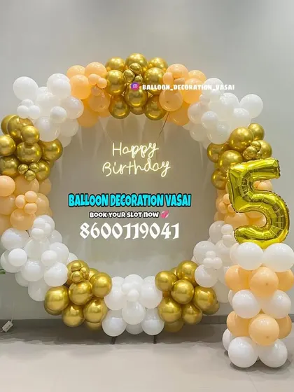 This elegant circular balloon frame was for a 56th birthday celebration in an office space. The mix of chrome gold, peach, and white balloons creates a sophisticated photo backdrop, complete with large foil numbers.