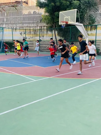 Players running suicides, a classic basketball drill for improving agility and conditioning.