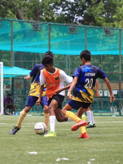Teamwork in action as our players close down an opponent to win back the ball.