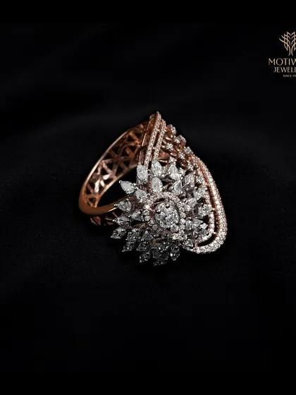A full view of the lace-like rose gold and diamond ring, showing its impressive scale and detailed craftsmanship. This is a statement piece that is both bold and feminine.