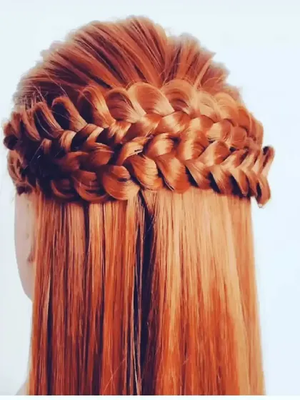 A classic waterfall braid on straight, open hair. This delicate hairstyle creates a cascading effect and is a beautiful choice for adding a touch of elegance to a simple look.
