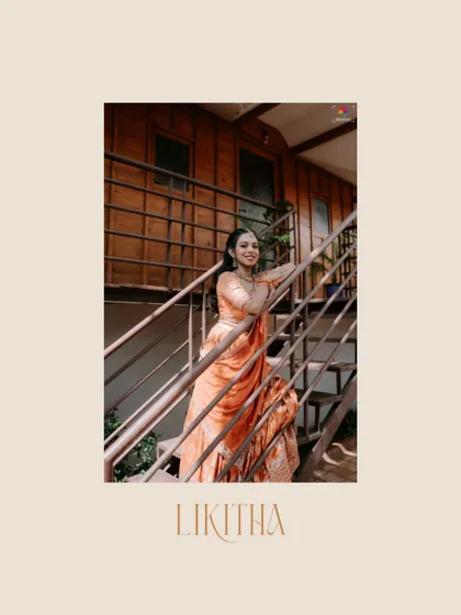 A relaxed and happy bridal portrait on a staircase. The bride's beautiful peach-colored lehenga shines in this candid moment, capturing her joyful spirit.