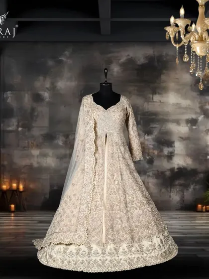 Elevate your style with this cream Indo-Western masterpiece, crafted from luxurious Tissue Silk and designed with intricate Persian detailing.