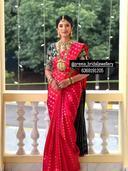 This bride chose a stunning long haaram with a large pendant, paired with a matching choker for her muhurtham look.