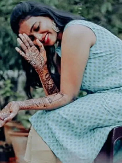 A candid shot of actress Rashmi Prabhakar enjoying her personalized mehendi. Her joy reflects the happiness I aim to bring to every bride.