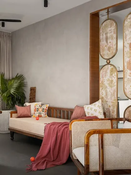 The living space of the 'Ittige' residence showcases our approach to modern Indian interiors. We integrated traditional elements like the wooden swing and cane furniture with a clean, contemporary layout, creating a space that feels both culturally rooted and refreshingly modern. The open plan allows for natural light to fill the room, connecting it to the outdoors.