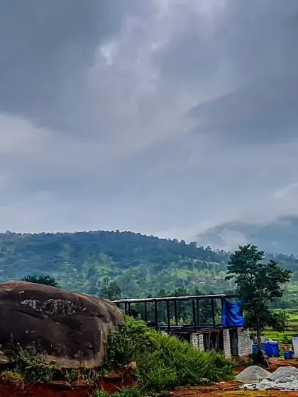 The site of the Soma house, with a large natural boulder in the foreground that we chose to preserve. The design process always begins with respecting the existing land, its features, and its moods.