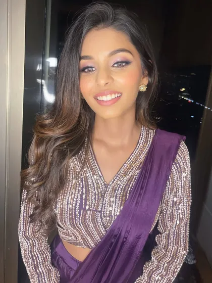A close-up to show the subtle shimmer and soft purple tones on the eyes, paired with a natural glossy lip.