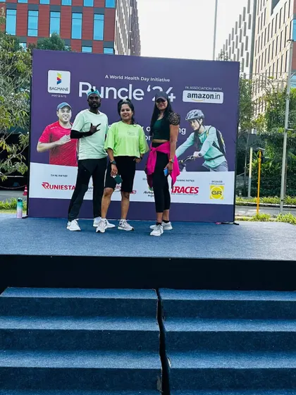 Posing with fellow fitness trainers at the Bagmane Tech Park event. Collaborating with other professionals helps create a more dynamic and engaging wellness experience.